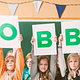 children holding a robbo sign