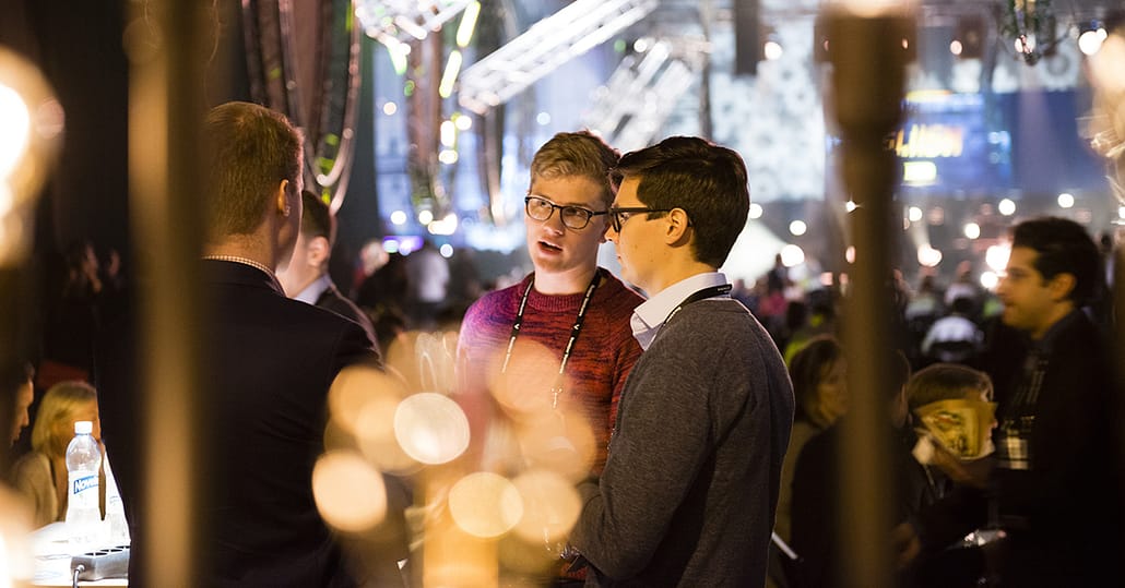 People having a chat at a Slush event in Helsinki