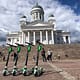 Lime e-scooters in front of Helsinki cathedral